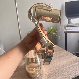 Worn Gold Ankle Strap Heels! faux leather straps cross over a peep-toe upper.